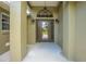 Inviting front porch with glass door and decorative lighting fixtures enhancing the entrance at 3720 Edsel Ave, St Cloud, FL 34772