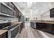 Spacious kitchen featuring stainless steel appliances, granite countertops and view to the living area at 3720 Edsel Ave, St Cloud, FL 34772