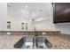 Stylish kitchen sink with granite countertops and stainless steel faucet under recessed lighting at 3720 Edsel Ave, St Cloud, FL 34772