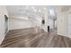 Bright living room with vaulted ceilings, recessed lighting, and wood-look flooring throughout at 3720 Edsel Ave, St Cloud, FL 34772