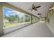 Large screened-in patio offering serene views of the backyard, perfect for outdoor relaxation and dining at 3720 Edsel Ave, St Cloud, FL 34772