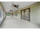 Spacious screened-in patio with multiple access points to the backyard, ideal for seamless indoor-outdoor living at 3720 Edsel Ave, St Cloud, FL 34772
