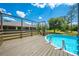 Poolside view from deck. An above-ground pool offering a refreshing backyard oasis at 3720 Edsel Ave, St Cloud, FL 34772