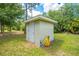Exterior view of shed in backyard surrounded by greenery, providing ample storage space at 3720 Edsel Ave, St Cloud, FL 34772