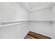 Bright, clean walk-in closet with white shelving and modern flooring at 3720 Edsel Ave, St Cloud, FL 34772