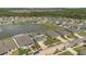 Residential area featuring neatly arranged homes around a scenic pond surrounded by lush trees at 374 Pine Tree Bridge Trl, St Cloud, FL 34772