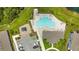 Aerial view of community pool, playground and parking lot showcasing recreational amenities at 374 Pine Tree Bridge Trl, St Cloud, FL 34772