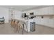 Modern kitchen featuring white cabinets, stainless steel appliances, a spacious island, and sleek finishes at 374 Pine Tree Bridge Trl, St Cloud, FL 34772