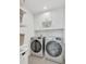Convenient laundry room with modern washer, dryer, and overhead cabinets for storage at 374 Pine Tree Bridge Trl, St Cloud, FL 34772