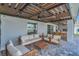 Covered patio features an outdoor seating area with a view of a trampoline and an outdoor kitchen at 374 Pine Tree Bridge Trl, St Cloud, FL 34772