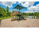 Community playground with slide and sunshade, perfect for Gathering activities and outdoor fun at 374 Pine Tree Bridge Trl, St Cloud, FL 34772