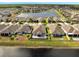 Beautiful aerial view of a lakefront community with well-maintained homes and green spaces at 3844 Cabo Rojo Dr, St Cloud, FL 34772