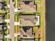 Aerial view of the neighborhood including the house, yards and streets at 3844 Cabo Rojo Dr, St Cloud, FL 34772