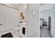 Charming bathroom with a decorative mirror, patterned shower curtain, and warm sconce lighting at 3844 Cabo Rojo Dr, St Cloud, FL 34772