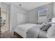 Comfortable bedroom includes a window view and a door to another room at 3844 Cabo Rojo Dr, St Cloud, FL 34772