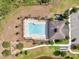 Aerial view of community pool, lounge chairs, spa, playground, and clubhouse with parking at 3844 Cabo Rojo Dr, St Cloud, FL 34772