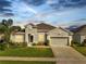 Charming single-story home with a well-manicured lawn and a two-car garage at 3844 Cabo Rojo Dr, St Cloud, FL 34772