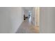 Bright hallway with tile flooring and neutral walls leading towards living area at 3844 Cabo Rojo Dr, St Cloud, FL 34772