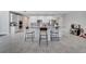 Spacious kitchen featuring an island with bar stool seating and white cabinetry at 3844 Cabo Rojo Dr, St Cloud, FL 34772
