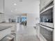 Open-concept kitchen with stainless appliances flowing into the bright living area at 3844 Cabo Rojo Dr, St Cloud, FL 34772