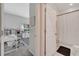 View of bright office and adjoining bathroom, featuring ample natural light and a clean, modern aesthetic at 3844 Cabo Rojo Dr, St Cloud, FL 34772