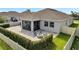 Inviting patio with a stone fire pit and comfortable seating, ideal for entertaining at 3844 Cabo Rojo Dr, St Cloud, FL 34772