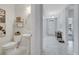 Stylish powder room with a pedestal sink, tiled flooring, and modern decor, perfect for guests at 3844 Cabo Rojo Dr, St Cloud, FL 34772