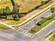 Whaley's Creek community entrance, beautifully landscaped, with manicured hedges and lush green grass at 3844 Cabo Rojo Dr, St Cloud, FL 34772