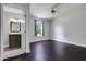 Bedroom with wood floors, natural light and an attached bathroom at 429 Diamond Acres Rd, Davenport, FL 33837