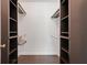Walk-in closet featuring shelving units and hanging rods for optimal storage at 429 Diamond Acres Rd, Davenport, FL 33837