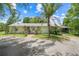 Charming single-story home with a neutral exterior, well-maintained landscaping, and a welcoming front entrance at 429 Diamond Acres Rd, Davenport, FL 33837