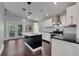 Modern kitchen featuring a center island with granite countertops and stainless appliances at 429 Diamond Acres Rd, Davenport, FL 33837