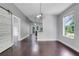 View from the living room into the dining area and kitchen with natural light at 429 Diamond Acres Rd, Davenport, FL 33837