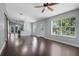 Spacious living room boasts wood floors and natural light at 429 Diamond Acres Rd, Davenport, FL 33837