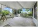 Spacious screened-in porch with bright lighting and a view of the backyard at 429 Diamond Acres Rd, Davenport, FL 33837