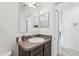 Bathroom featuring a single sink vanity with modern fixtures and a shower at 4324 Desert Rose, Kissimmee, FL 34746