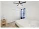 Bright bedroom featuring a ceiling fan, carpet, and closet space at 4324 Desert Rose, Kissimmee, FL 34746