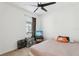 Small bedroom with a ceiling fan and entertainment setup at 4324 Desert Rose, Kissimmee, FL 34746