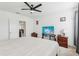 Comfortable bedroom featuring neutral walls, carpet flooring, two windows, and a ceiling fan at 4324 Desert Rose, Kissimmee, FL 34746