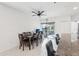 Bright dining area with tile floors, ceiling fan, and sliding glass doors to the lanai at 4324 Desert Rose, Kissimmee, FL 34746