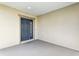 Covered front porch featuring a traditional front door, ceiling, and a concrete floor at 4324 Desert Rose, Kissimmee, FL 34746