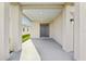 Inviting covered front porch with a gray front door, recessed lighting, and neutral color palette at 4324 Desert Rose, Kissimmee, FL 34746