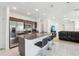 Modern kitchen features stainless steel appliances, granite countertops, and breakfast bar seating at 4324 Desert Rose, Kissimmee, FL 34746