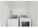 This clean laundry room features a modern, high-efficiency washer and dryer at 4324 Desert Rose, Kissimmee, FL 34746