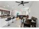 Open floor plan with breakfast bar seamlessly connecting the living room, dining area, and kitchen at 4324 Desert Rose, Kissimmee, FL 34746