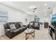 Spacious living room flowing into the dining and kitchen areas, with comfortable seating and a ceiling fan at 4324 Desert Rose, Kissimmee, FL 34746
