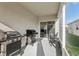 Screened patio with two black grills at 4324 Desert Rose, Kissimmee, FL 34746