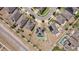 Aerial view of the neighborhood with solar panels, green turf, and white fences at 4804 Marcos Cir, Kissimmee, FL 34758