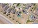 Aerial view of the neighborhood with solar panels, green turf, and white fences at 4804 Marcos Cir, Kissimmee, FL 34758
