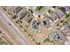Aerial view of the neighborhood with solar panels, green turf, and white fences at 4804 Marcos Cir, Kissimmee, FL 34758